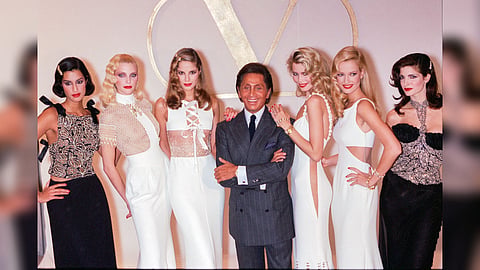 Fashion desgner Valentino (C) pose backstage with models Naja Auermann (2L), Claudia Schiffer 3rd R), Karen Mulder (2nd R) and Stephanie Seymour (R) during the Valentino Ready to Wear Spring/Summer 1995 show as part of Paris Fashion Week on October 15, 1994 in Paris, France.