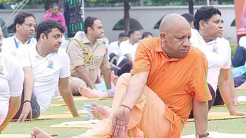 Uttar Pradesh Chief Minister Yogi Adityanath performs yoga at the Raj Bhavan premises on the occasion of the 10th International Day of Yoga, in Lucknow