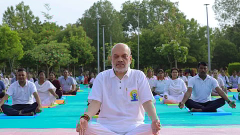 Union Home Minister Amit Shah performs yoga with others at Gotila Garden on the 10th International Day of Yoga, in Ahmedabad