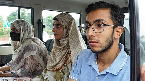 Family members of Kashmiri leader Sheikh Abdul Rashid alias Engineer Rashid leave after the latter took oath as Lok Sabha MP, outside the Parliament in New Delhi