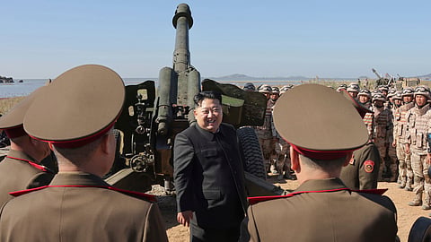 North Korean leader Kim Jong Un, center, visits to watch an artillery exercise at an undisclosed place in North Korea