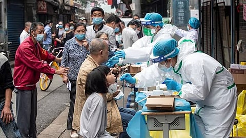 China plays down reports of huge flu outbreak; says country safe for travel