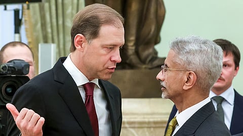 Russian First Deputy Prime Minister Denis Manturov, front left, talks with Indian Foreign Minister Subrahmanyam Jaishankar, front right, prior to a meeting with Russian President Putin