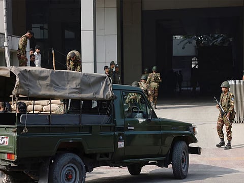 Bangladesh takes 15 serving and former army officers into military custody
