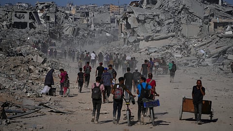 Thousands of Palestinians return to what's left of their homes as Gaza ceasefire takes effect