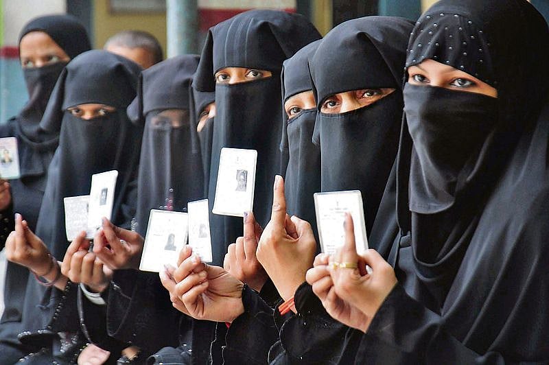 Amid protests, EC upholds burqa identity...