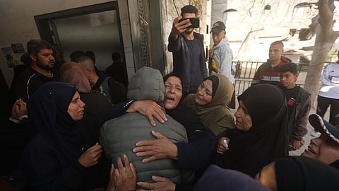 Palestinians hold funerals for pregnant woman, her children killed in Israeli strikes