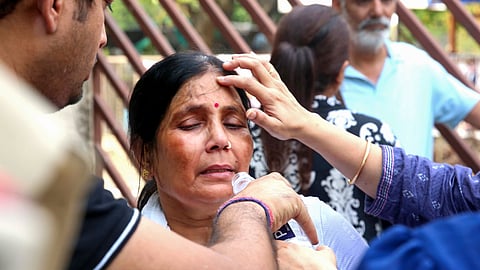 Family members of Twisha Sharma, who allegedly died by suicide over dowry-related mental harassment, outside the district court during a hearing in the case