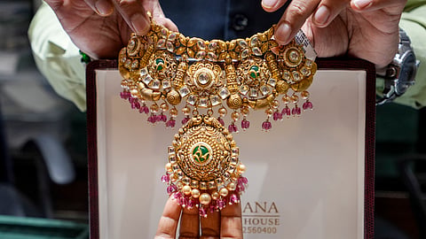 Gold drops Rs 400 amid weak global trend; silver slumps Rs 5,000
