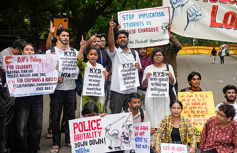 Demonstrators hold placards during a protest against the police crackdown on students and youth over the NEET paper leak issue, at Jantar Mantar, in New Delhi | File image/PTI