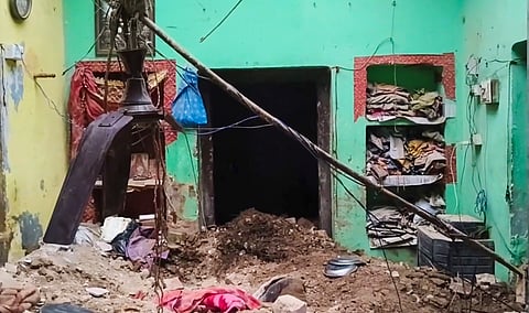 People gather after a portion of a dilapidated house collapsed, killing six people, in Mahuli village of Pratapgarh district, Uttar Pradesh, on Thursday | PTI