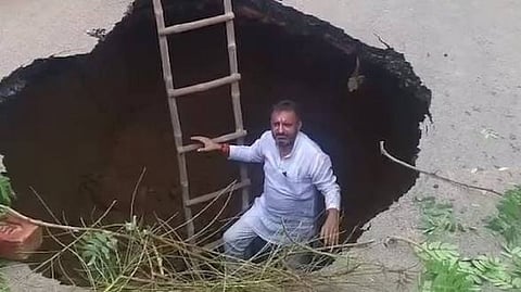 Agra road caves in after heavy rain, SP leader climbs into crater to ‘measure development’