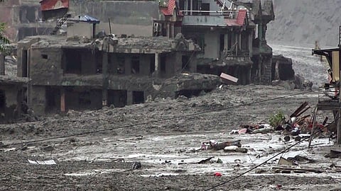 An area covered in mud and silt washed along the devastating flash floods, in Dhading district, Nepal, on Friday | PTI