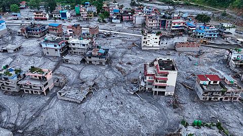 An aerial view of damaged structures covered in thick mud and debris in the aftermath of flash floods, at Devighat, in Nuwakot district, Nepal, on Saturday | PTI