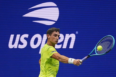Mariano Navone, of Argentina, returns the ball to Novak Djokovic, of Serbia, during the first round of the US Open tennis championships Sunday, August 30, in New York | PTI
