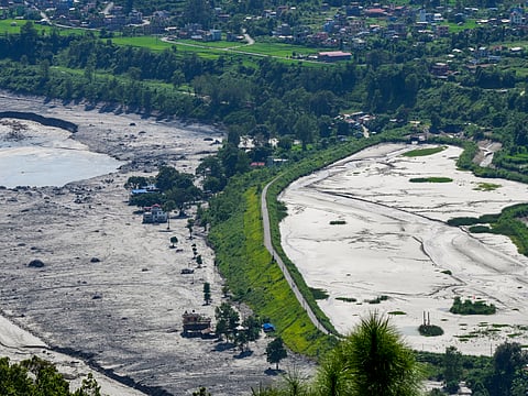 A residential area covered in thick mud in the aftermath of flash floods, at Trishuli market, in Nuwakot district, on  Sunday | PTI