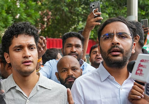 Cockroach Janta Party spokespersons Saurav Das and Ashutosh Ranka along with party supporters move towards the Parliament Street Police Station, in New Delhi, on Friday | PTI