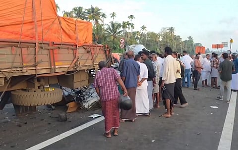 People gather near wreckage of a car after it collided with a lorry parked on the highway at Kaipamangalam, in Thrissur district, Keralam, on Saturday | PTI