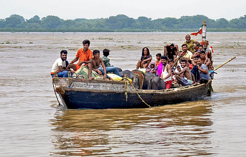 People arrive from a flooded area following a rise in the water level of the Ganga river, in Patna, Bihar | File Image