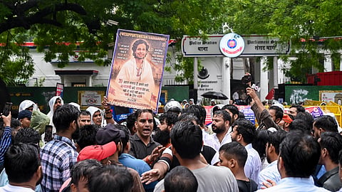 Supporters of Hindutva influencer Swatantra Bhardwaj stage a protest outside Parliament Street police station following the detention of self-styled Hindutva influencer Swatantra Bhardwaj