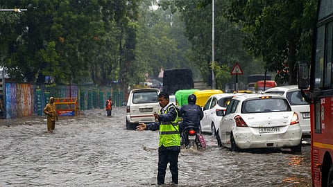 Around 30 people stranded on rocks and trees were rescued as Fire and Rescue Services, police, forest officials and local volunteers searched for five missing people

