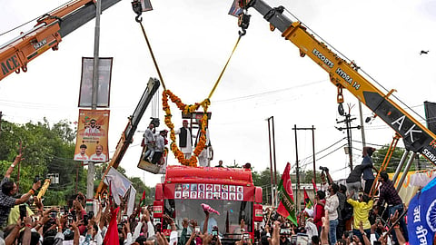 Samajwadi Party chief Akhilesh Yadav greets supporters while leading a roadshow ahead of the 2027 Uttar Pradesh Assembly elections, in Rae Bareli, Uttar Pradesh, on Thursday | PTI