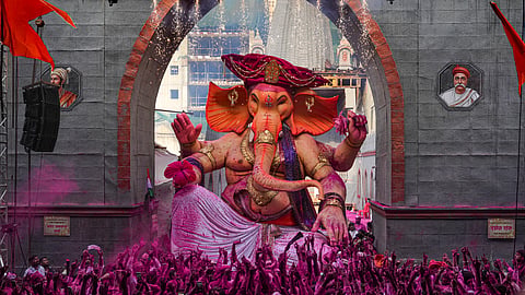 People take an idol of lord Ganesh, Raja Tejukaya, for an immersion ceremony during the conclusion of Ganesh Chaturthi festival, in Mumbai, on Friday | PTI
