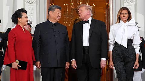 President Donald Trump and first lady Melania Trump greet China's President Xi Jinping and his wife Peng Liyuan as they arrive at the White House for a State Dinner, on Thursday | PTI