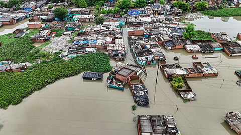 An aerial view of a residential area partially inundated after heavy rainfall and subsequent rise in the Pandu River water level, in Kanpur, on Sunday | PTI