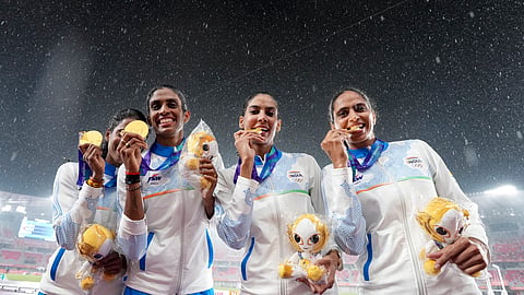 India's Kiran, Prachi, Poovama Machettira, and Vithya Ramraj pose for photographs after winning gold medal in the women's 4 x 400 relay final in the ongoing Asian Games 2026, in Nagoya, Japan | PTI