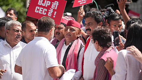INDIA bloc MPs raise slogans and hold placards demanding the resignation of CEC Gyanesh Kumar as they march from Parliament towards the ECI office, in New Delhi, on Tuesday | PTI 