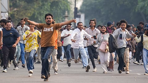 Demonstrators during a protest organised by the Cockroach Janta Party (CJP) demanding the resignation of CEC Gyanesh Kumar, at Connaught Place, in New Delhi, on Saturday | PTI