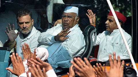 Congress President Mallikarjun Kharge, party leader Rahul Gandhi greet the supporters from a bus, procceding towards the Supreme Court, in New Delhi, on Monday | PTI