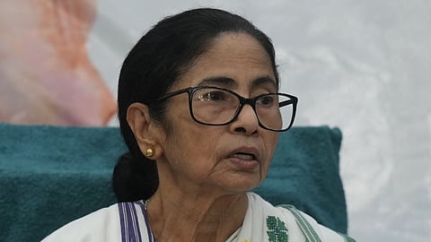 Police examine video footage and question the woman as party leaders raise concerns over Banerjee's security

