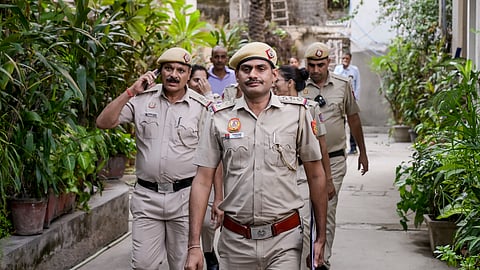 Police personnel outside the residence where CJP founder Abhijeet Dipke is staying, ahead of the party's 'Lehra Do Tiranga' rally, in New Delhi, on Friday | PTI