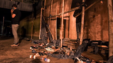 Footwear lies scattered outside a Durga Puja pandal after the exit gate collapsed due to heavy crowd pressure, leading to a stampede-like situation, in Kolkata, on Saturday | PTI