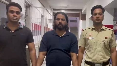 Police personnel arrests social media influencer Amir Shokeen following a viral video depicting the alleged racial harassment and humiliation of a youth from Tripura, in New Delhi, on Thursday | PTI