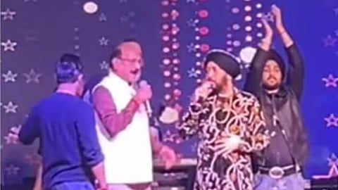 The Daler Mehndi controversy has escalated after Mika Singh criticised minister Subodh Uniyal and appealed to Uttarakhand CM Pushkar Singh Dhami to look into the incident | X