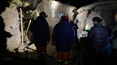 Firefighters inspect an earthquake-hit village houses in Baqen County of Nagqu City in China's Tibet autonomous region, on Friday | PTI