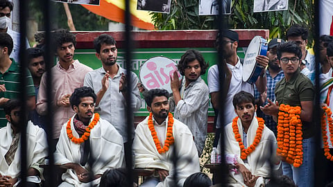 Administration agreed to withdraw disciplinary action against protesters as prolonged agitation over restoration of elected union continued
