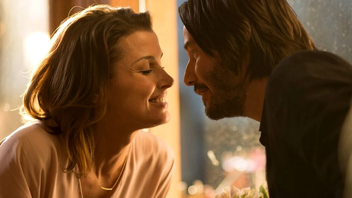 John Wick (Keanu Reeves) and his late wife Helen (Bridget Moynahan). 