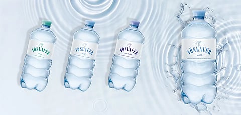 Amcor and Vöslauer strengthen sustainability with customized tethered cap solution