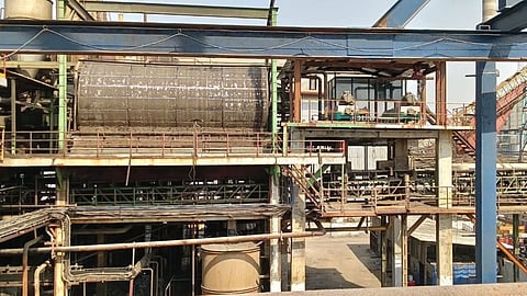 GEA decanter centrifuges positioned to the right of a rotary vacuum drum filter, illustrating the significantly smaller footprint of decanter-based sugar mud dewatering solutions.