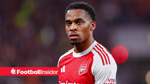 Arsenal right-back Jurrien Timber starring into the distance during a game