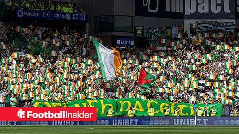 Celtic fans waving Ireland flags at Ibrox.