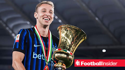 Davide Frattesi of FC Internazionale celebrates with the trophy during the award ceremony following the Coppa Italia final football match between SS Lazio and FC Internazionale