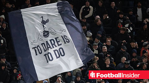 Tottenham supporters waving a 'To Dare Is To Do' banner at the Tottenham Hotspur Stadium