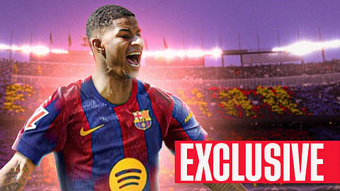 Marcus Rashford celebrating in a Barcelona kit at the Nou Camp