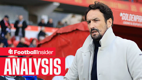 Cesar Peixoto in a white coat by the stadium tunnel