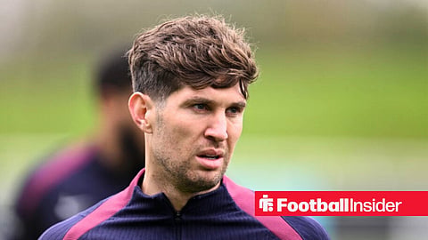 Former Manchester City defender John Stones looking concerned in England training kit 